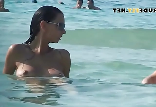 Hot nudist indulge sunbathes chiefly nude beach