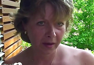 Busty milf shows the brush pussy in a close-up