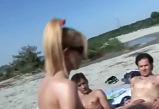 group fucking on a nude shore